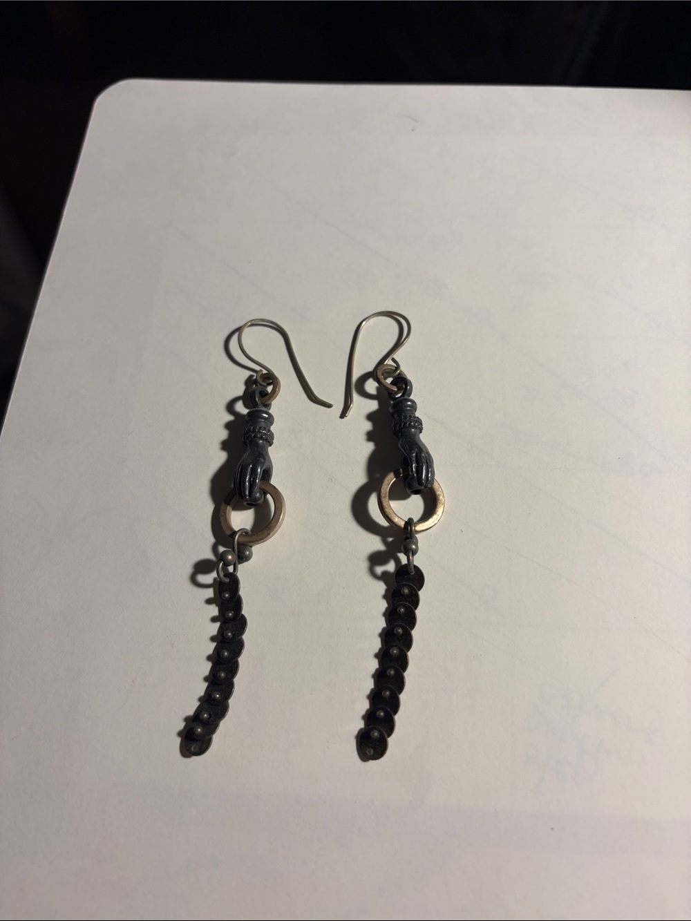 Black/Silver Beaded Dangle Earrings Hands holding dangle